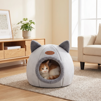 Cat resting inside the ZooBliss Cozy Cat-Ear Cave Bed