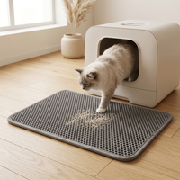 Double-layer cat litter trapping mat in a modern home beside a litter box