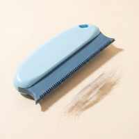 Reusable pet hair remover brush with gathered pet hair on a neutral studio surface