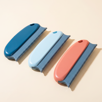 Reusable pet hair remover brush on a warm neutral studio background
