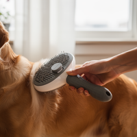 Dog being groomed with a gray self-cleaning slicker brush
