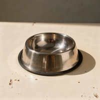 Stainless steel pet bowl on a warm natural background